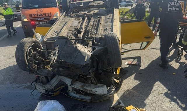 Taksi bariyerlere çarpıp takla attı: 2 yaralı   